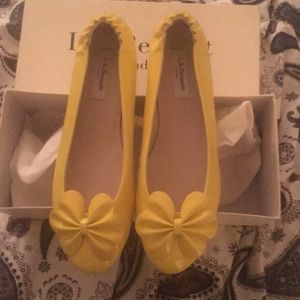 Yellow LK Bennet flats with bow never worn